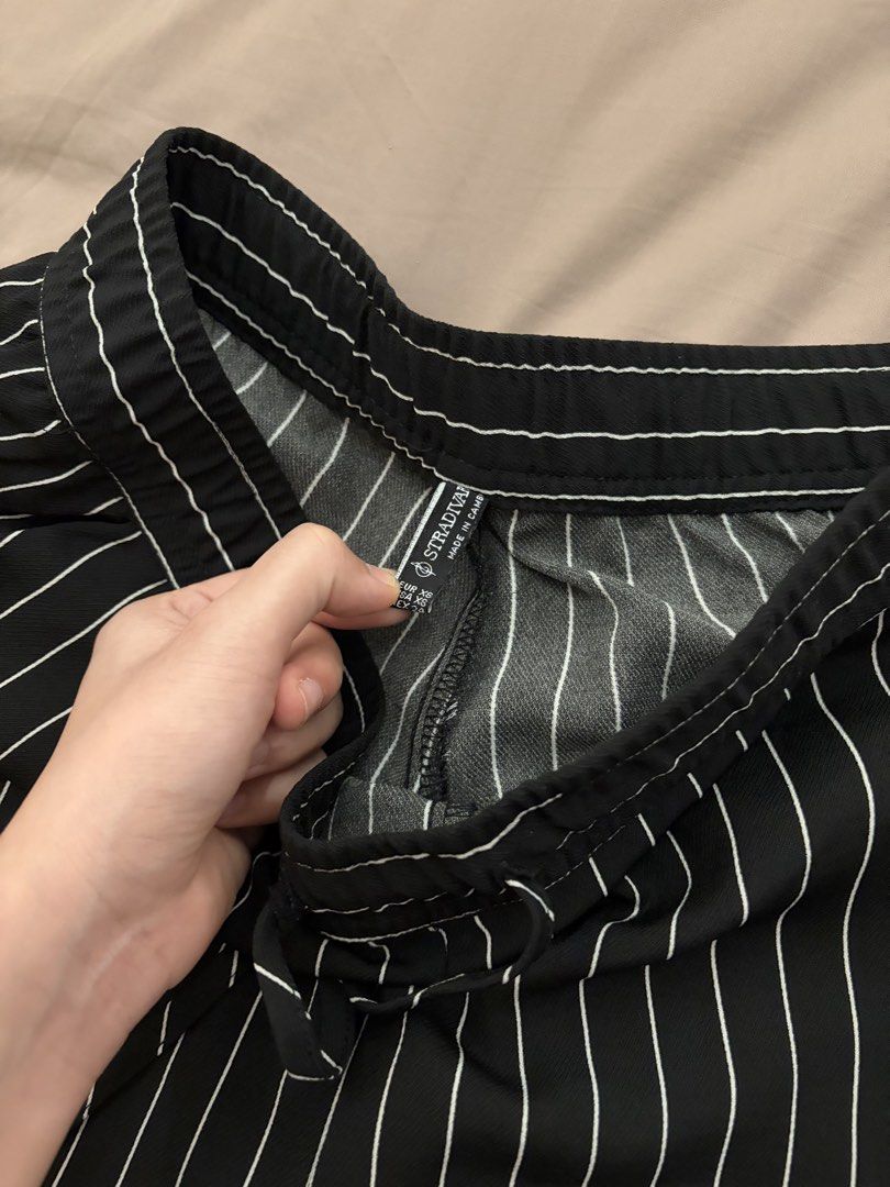 Wide Leg Pants (Category: Jeans) located in Pasig City. Submitted by gdeclutterwithme (Listing ID 1470120335, Image 3). Description: - Brand: Stradivarius - Size: XS - Color: Black with white pinstripes - Fit: Wide leg - Waist: Adjustable drawstring with side zipper closure - Origin: Made in Cambodia - Condition: Clean fabric, excellent staple for casual or smart casual outfits (and formal!) dm for more deets ! .