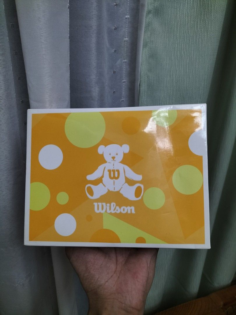 Wilson Bear Golf Balls Box Set (Category: Golf) located in Cainta. Submitted by banzvi73 (Listing ID 1469978195, Image 1). Description: - Complete box set with 4 inner boxes featuring cute Wilson Bear graphics - Designed specifically for women golfers in vibrant yellow and green - Two-piece construction with high trajectory 392 dimples and high repulsion soft core - Made in Japan with premium quality - Condition: Brand new balls, box has slight w