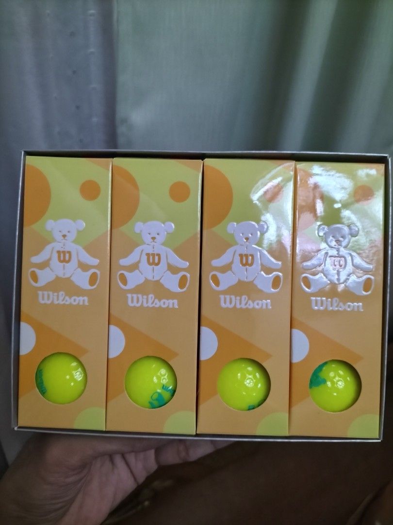 Wilson Bear Golf Balls Box Set (Category: Golf) located in Cainta. Submitted by banzvi73 (Listing ID 1469978195, Image 2). Description: - Complete box set with 4 inner boxes featuring cute Wilson Bear graphics - Designed specifically for women golfers in vibrant yellow and green - Two-piece construction with high trajectory 392 dimples and high repulsion soft core - Made in Japan with premium quality - Condition: Brand new balls, box has slight w