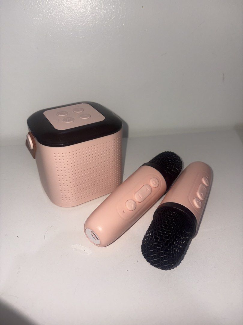 Wireless Karaoke Speaker with Two Microphones Pink (Category: Soundbars, Speakers & Amplifiers) located in Manila. Submitted by rodriguesyb (Listing ID 1469996525, Image 3). Description: Mini wireless karaoke set in pink. Includes one portable bluetooth speaker with a carrying strap and two matching wireless microphones. Supports 3.5mm aux and TF card playback. Compact size, great for home use or small gatherings. Original box included. Everythin