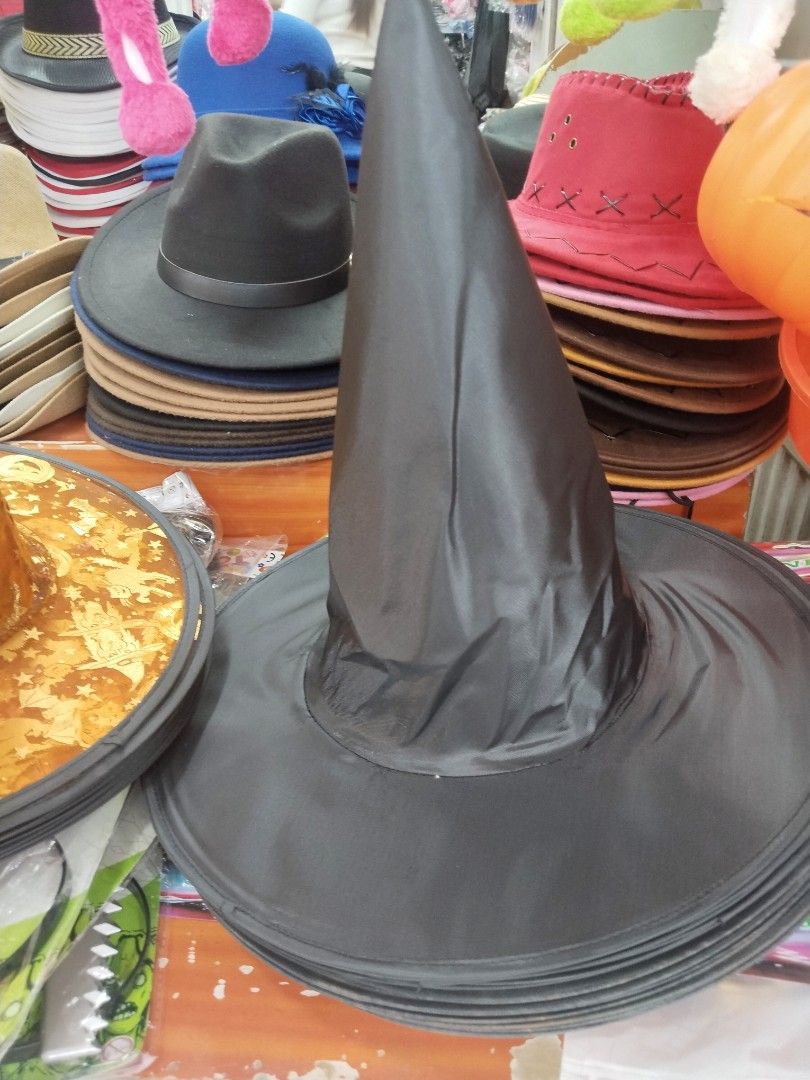 Witch Hat (Category: Hats & Beanies) located in Manila. Submitted by zdmal (Listing ID 1469964006, Image 2). Description: - Set of 2 Halloween witch hats for costumes, trick-or-treating, or spooky decor - Hat 1: Classic solid black fabric finish with a wide brim - Hat 2: Festive orange metallic foil with fun pumpkin and leaf patterns - Foldable design allows for quick and easy storage - Perfect for matching looks, couples, or party use.