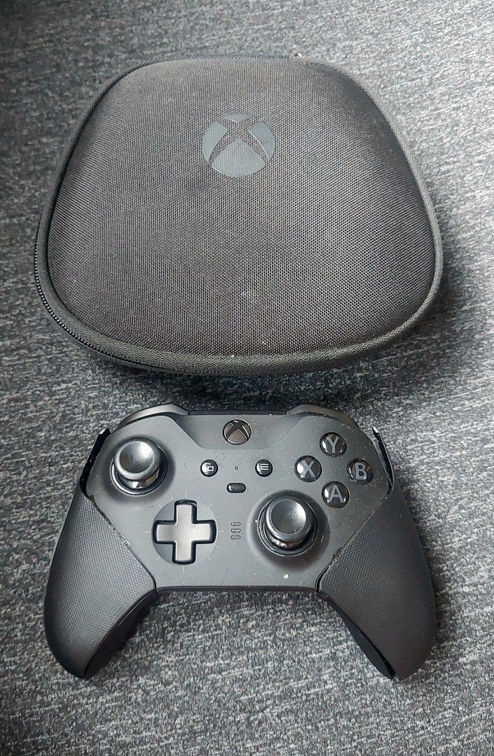 Xbox Elite Wireless Controller Series 2 Black with Case and Accessories (Category: Controllers) located in Makati City. Submitted by kamotejoe (Listing ID 1469982346, Image 2). Description: selling: Black Xbox Elite Wireless Controller Series 2 for 3000 Includes: Controller case charging dock 3 paddles 3 joysticks cross directional button price is fixed Condition: - Needs faceplate replacement, - Left stick sometimes get stuck -Missing 1 paddle, 