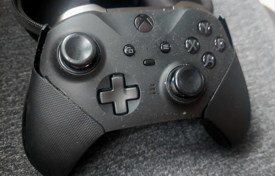 Xbox Elite Wireless Controller Series 2 Black with Case and Accessories (Category: Controllers) located in Makati City. Submitted by kamotejoe (Listing ID 1469982346, Image 1). Description: selling: Black Xbox Elite Wireless Controller Series 2 for 3000 Includes: Controller case charging dock 3 paddles 3 joysticks cross directional button price is fixed Condition: - Needs faceplate replacement, - Left stick sometimes get stuck -Missing 1 paddle, 