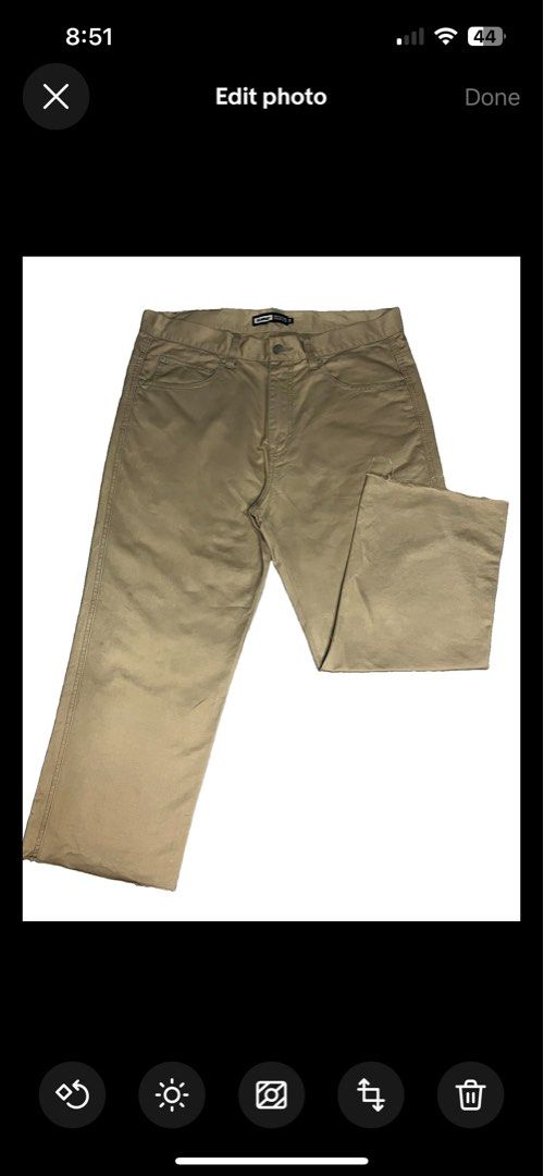 XLarge Beige Chino Pants Size 34 (Category: Chinos) located in Muntinlupa City. Submitted by pastforwardthrift (Listing ID 1470125485, Image 1). Description: - Size: XLarge (Fits waist size 34) - Color: Neutral khaki / tan - Fit: Straight leg cut - Details: Bold white branding on back waistband, logo-stamped metal button - Accent: Leather patch with gorilla graphic on back pocket - Style: Essential streetwear staple.