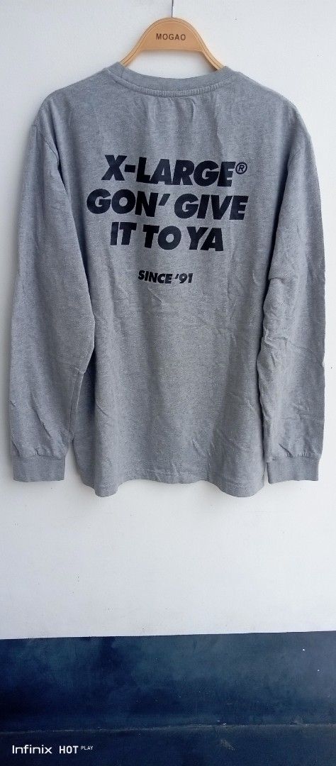 X-Large Grey Long Sleeve Tee Gorilla Graphic (Category: Tshirts & Polo Shirts ) located in Manila. Submitted by rhegsthrifted (Listing ID 1470065739, Image 2). Description: - Brand: X-Large - Color: Grey - Size: Large - Dimes: Width - 21 x Length - 28 - Material: 100% Cotton - Fit: Standard fit with crew neck - Details: Large chest gorilla graphic and 'X-Large Gon' Give It To Ya Since '91' back print - Condition: Great casual streetwear piece - I