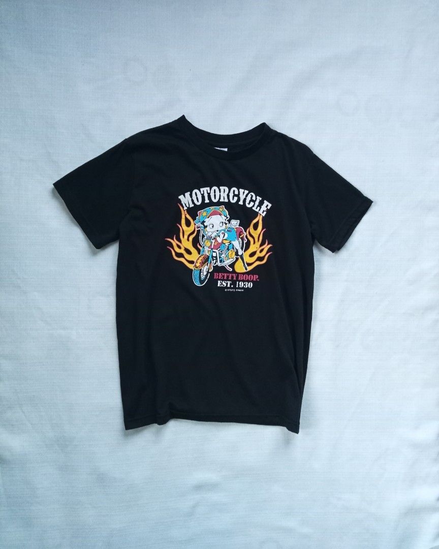 Y2k Betty Boop flame graphic tee (Category: Shirts) located in Bagabag. Submitted by thrift_stories96 (Listing ID 1470119488, Image 1). Description: Y2k Betty Boop flame graphic tee Medium Length - 23 Width - 18.5 Condition - excellent No flaw.