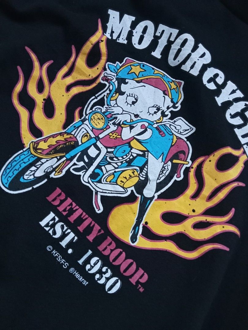 Y2k Betty Boop flame graphic tee (Category: Shirts) located in Bagabag. Submitted by thrift_stories96 (Listing ID 1470119488, Image 3). Description: Y2k Betty Boop flame graphic tee Medium Length - 23 Width - 18.5 Condition - excellent No flaw.