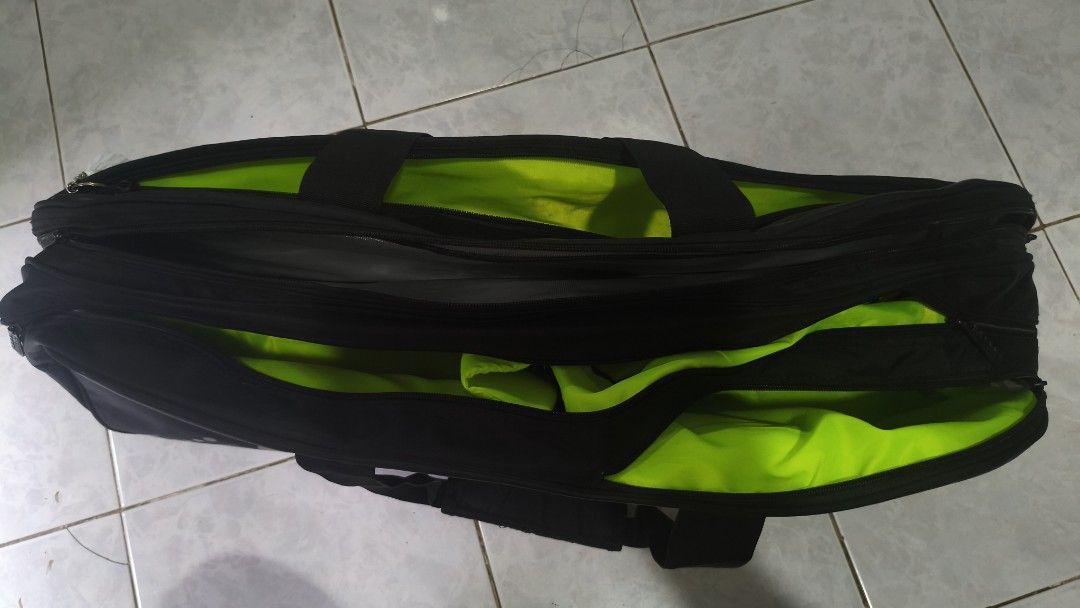 Yonex Badminton Bag (Category: Racket and Ball Sports) located in Manila. Submitted by findsbyryy (Listing ID 1469975703, Image 2). Description: Selling my Yonex badminton tournament bag in black with a sleek design and gold-tone accents. Perfect for badminton players who need a spacious bag to organize their rackets and playing essentials..
