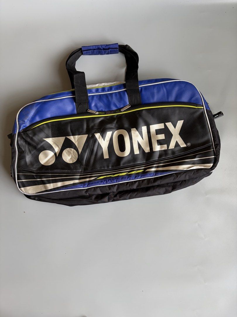 Yonex Pro Badminton Bag Blue Black (Category: Racket and Ball Sports) located in Kibawe. Submitted by jeloots (Listing ID 1469999545, Image 1). Description: - Authentic Yonex Pro sports bag in a sleek black and blue colorway with a bold front logo - Eye-catching neon yellow interior lining with multiple compartments for organized gear storage - Equipped with dual carry handles and a secure side buckle closure - Crafted from rugged, durable materi