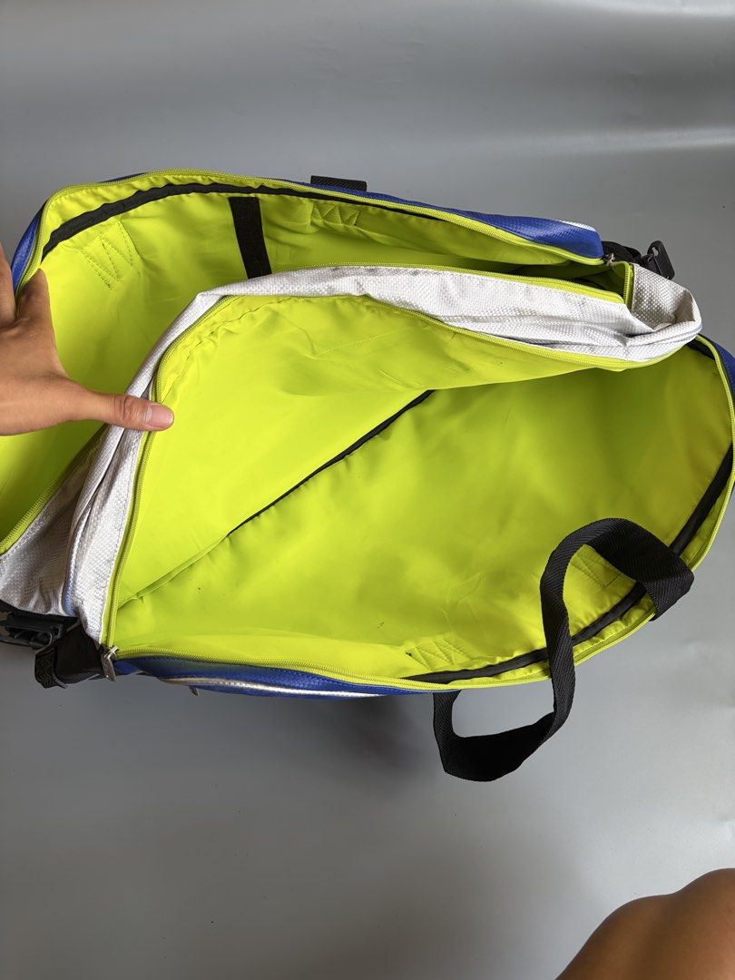 Yonex Pro Badminton Bag Blue Black (Category: Racket and Ball Sports) located in Kibawe. Submitted by jeloots (Listing ID 1469999545, Image 3). Description: - Authentic Yonex Pro sports bag in a sleek black and blue colorway with a bold front logo - Eye-catching neon yellow interior lining with multiple compartments for organized gear storage - Equipped with dual carry handles and a secure side buckle closure - Crafted from rugged, durable materi