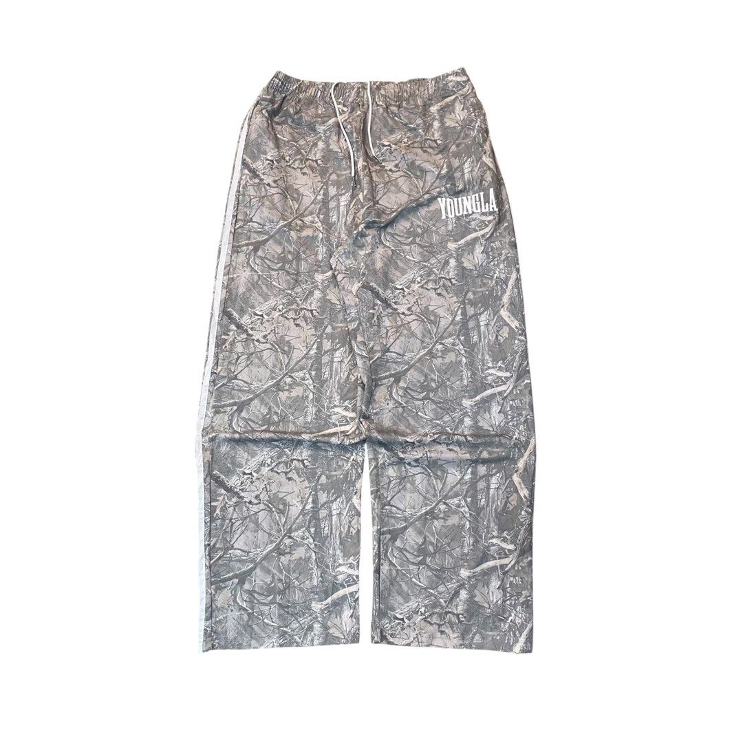 YoungLA Tree Camo Baggy Sweat pants (Category: Trousers) located in Iloilo. Submitted by nextwearco_ilo (Listing ID 1469999055, Image 1). Description: YoungLA Tree Camo Baggy Sweat pants • Like new condition • 30-40 W x 42 L • 10.5 Leg opening • No flaws - cut washtag ₱ 1.8k Dm.