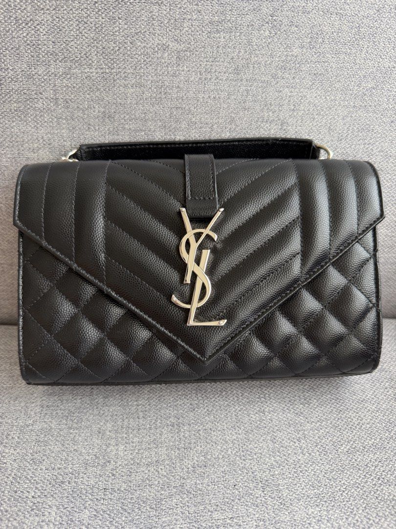 YSL TRIQUILT SMALL SHOULDER BAG (Category: Luxury Bags & Wallets) located in Makati City. Submitted by theladyluxe.ph (Listing ID 1469948048, Image 2). Description: ✨YSL ENVELOPE TRIQUILT SMALL BLACK SHW✨ Rank A Very good condition w/ box, dust bag & certificate of authenticity Store Price 185k++ 🏷️ 100k only for 3mo LA Nego for cash 💳 MOP: BPI/Bank Transfer/Gcash/Maya/Paypal DISCLAIMER: theladyluxxe is NOT AFFILIATED with any brand posted on t