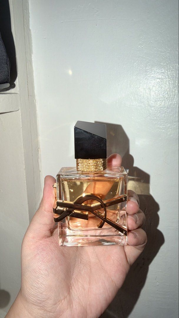 Yves Saint Laurent Libre Eau De Parfum 30ml (Category: Fragrance & Deodorants) located in Magalang. Submitted by josephinenl (Listing ID 1470098361, Image 2). Description: Bought in AU. I still have the copy of the receipt. Sprayed around 3-4 times only. YSL Libre Eau de Parfum, 30ml bottle. Iconic oversized gold Cassandre logo wrapping the glass. Asymmetric black cap with gold chain detailing around the neck. Warm floral fragrance with lavender 