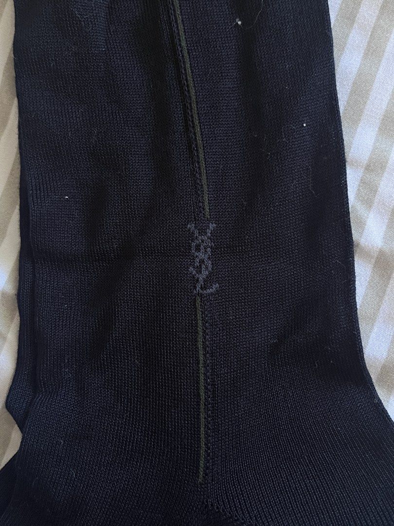 Yves Saint Laurent socks (Category: Socks) located in Baguio. Submitted by gbwardrobe (Listing ID 1470058496, Image 1). Description: - Bundle of premium black designer dress socks - Includes Yves Saint Laurent (YSL) pairs with monogram logo and vertical seam - Includes DAKS pairs with embroidered logo branding - Classic ribbed knit style - Great for formal and business wear - Clean and well-maintained condition.