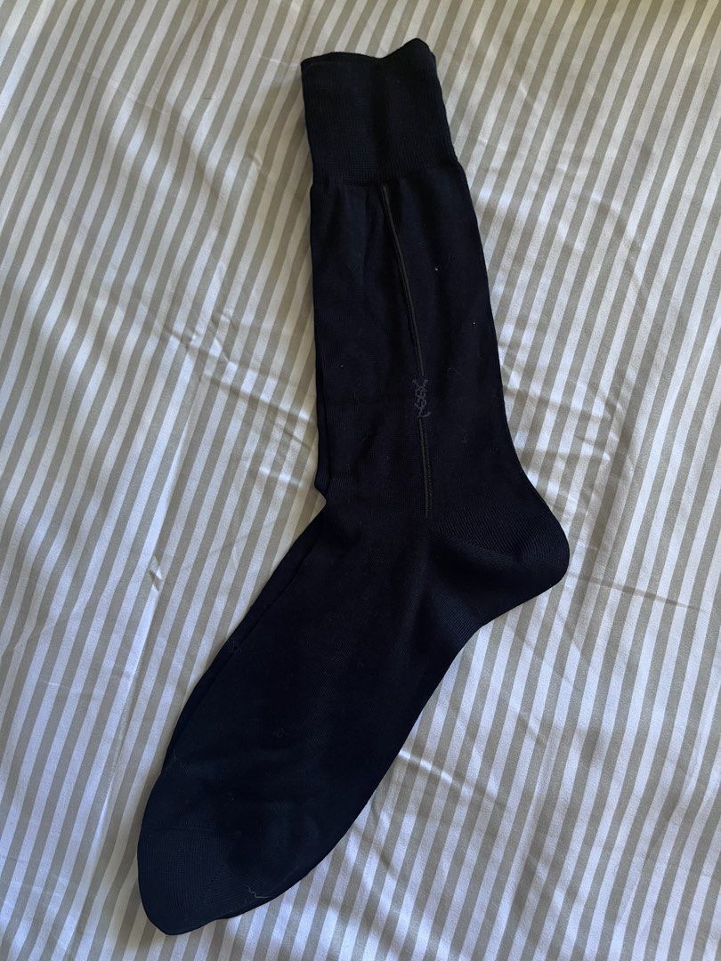 Yves Saint Laurent socks (Category: Socks) located in Baguio. Submitted by gbwardrobe (Listing ID 1470058496, Image 2). Description: - Bundle of premium black designer dress socks - Includes Yves Saint Laurent (YSL) pairs with monogram logo and vertical seam - Includes DAKS pairs with embroidered logo branding - Classic ribbed knit style - Great for formal and business wear - Clean and well-maintained condition.
