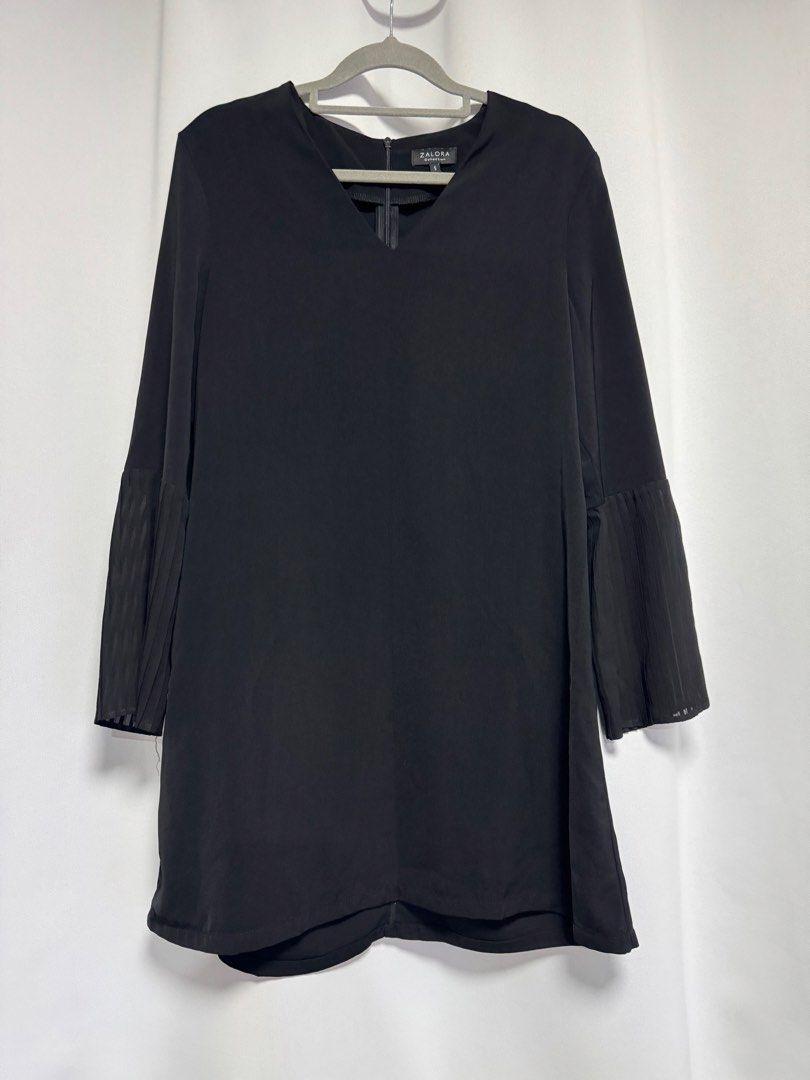 Zalora Collection Black Dress (Category: Dresses) located in Calamba. Submitted by cheriiv (Listing ID 1469950695, Image 1). Description: - Brand: Zalora Collection - Size: Small - Color: Classic Black - Design: V-neckline, back zipper closure, and long sleeves with trendy pleated flared cuffs - Fabric: Lightweight with a smooth finish - Condition: Excellent, minimal wear observed.