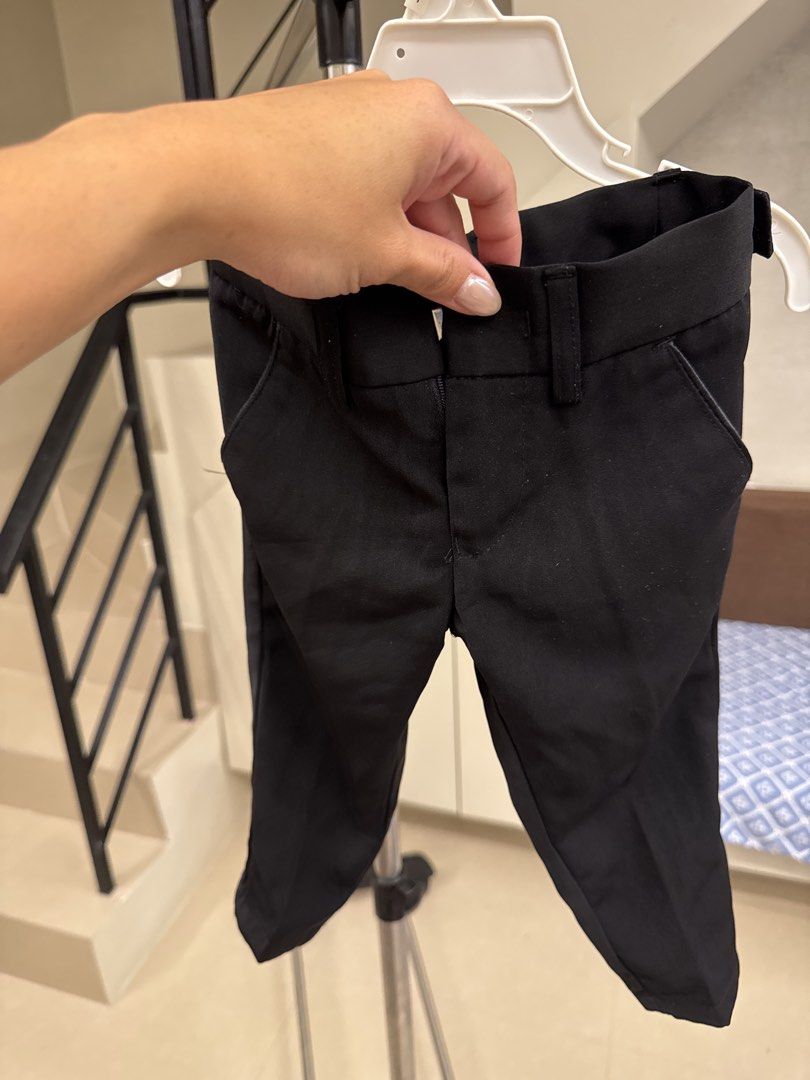 Zanetti Black Trousers Size M (Category: Babies & Kids Fashion) located in Manila. Submitted by __nix (Listing ID 1470019938, Image 1). Description: - Brand: Zanetti - Size: M - Color: Classic Black - Features: Belt loops, front pockets, button-closure back pockets - Special Detail: Striped inner waistband lining - Style: Versatile staple for smart casual or formal outfits - Matching: Easy to pair with shirts and blazers.