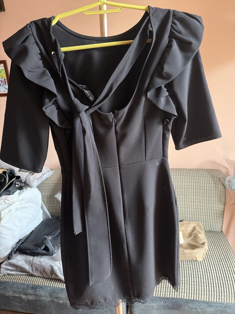 Zara Basic Black Ruffle Dress with Tie Back (Category: Dresses) located in Caloocan City. Submitted by ninzguevarra-94363 (Listing ID 1470002787, Image 2). Description: - Brand: Zara Basic - Color: Classic Black - Sleeves: Half sleeves with trendy ruffle shoulder details - Closure: Convenient back zipper with a chic tie-strap design - Hemline: Elegant subtle lace trim - Condition: Excellent / well-maintained; just needs to wash before wearing. - 