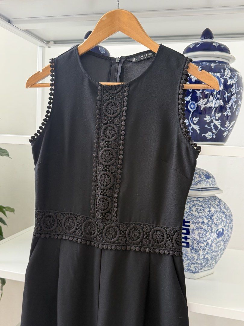 Zara Basic Black Sleeveless Lace Jumpsuit Size S (Category: Jumpsuits) located in Lipa City. Submitted by pauline0303 (Listing ID 1469954713, Image 2). Description: - Brand: Zara Basic - Style: Sleeveless jumpsuit - Size: S - Color: Solid black - Details: Intricate crochet lace trim on the front bodice and waist, scalloped lace edging on armholes - Closure: Back zipper - Condition: Clean and ready to wear - A little bit of lose thread on the fron