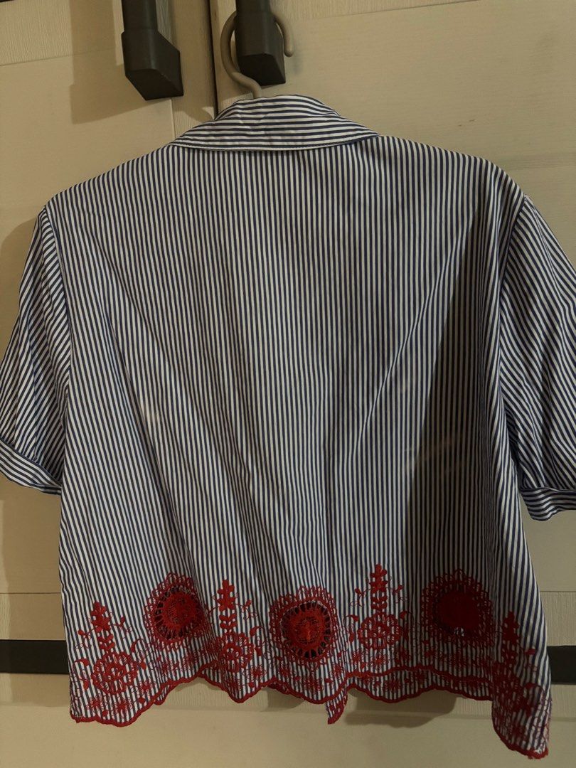 Zara Basic Collection Blue Striped Shirt with Red Embroidery (Category: Longsleeves) located in Antipolo. Submitted by jennibee (Listing ID 1469987831, Image 3). Description: - Brand: Zara Basic Collection - Size: S - Design: Blue and white vertical stripes with red lace embroidery - Details: Collared, front button closure, cuffed short sleeves, scalloped hemline - Condition: Great piece for casual days or smart-casual wear - Mode of Payment: Gca