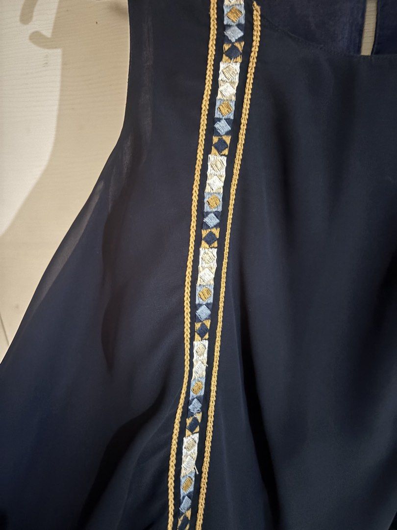 Zara Basic Navy Embroidered Sleeveless Top Size S (Category: Sleeveless) located in Antipolo. Submitted by jennibee (Listing ID 1469986914, Image 3). Description: - Brand/Model: Zara Basic - Size: S - Color: Navy blue with blue, white, and gold embroidery - Material: Lightweight chiffon - Details: Sleeveless, geometric embroidery on front and bottom hem, back keyhole cutout with button closure - Condition: Excellent.