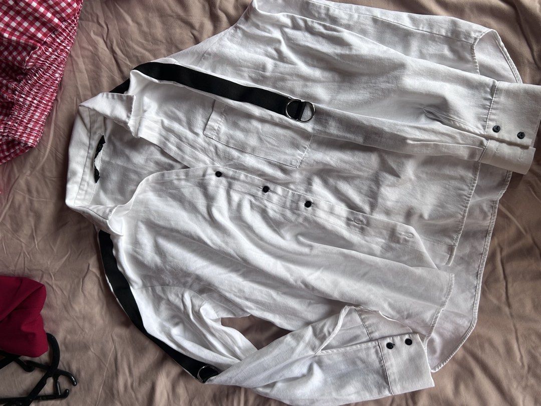 Zara Basic White Button-Down Shirt with Black Stripes Size S (Category: Shirts) located in Cebu City. Submitted by shopmikascloset (Listing ID 1469956263, Image 2). Description: - Brand: Zara Basic - Size: S (Made in Morocco) - Color: White with contrast black stripes on shoulders and sleeves - Details: Metal ring on right sleeve and single left chest pocket - Style: Standard collar, button cuffs, clean and versatile.