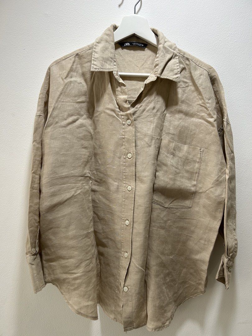 ZARA Beige Linen Long Sleeve Button-Down Shirt (Category: Longsleeves) located in Manila. Submitted by isabelle_1104 (Listing ID 1470026599, Image 2). Description: ZARA linen button-down shirt in beige. Classic collar, front button closure, single chest pocket. Long sleeves with button cuffs. Relaxed fit with a pleated back yoke detail. Lightweight and breathable fabric, great for layering or casual wear. Size S as indicated on the inner collar l