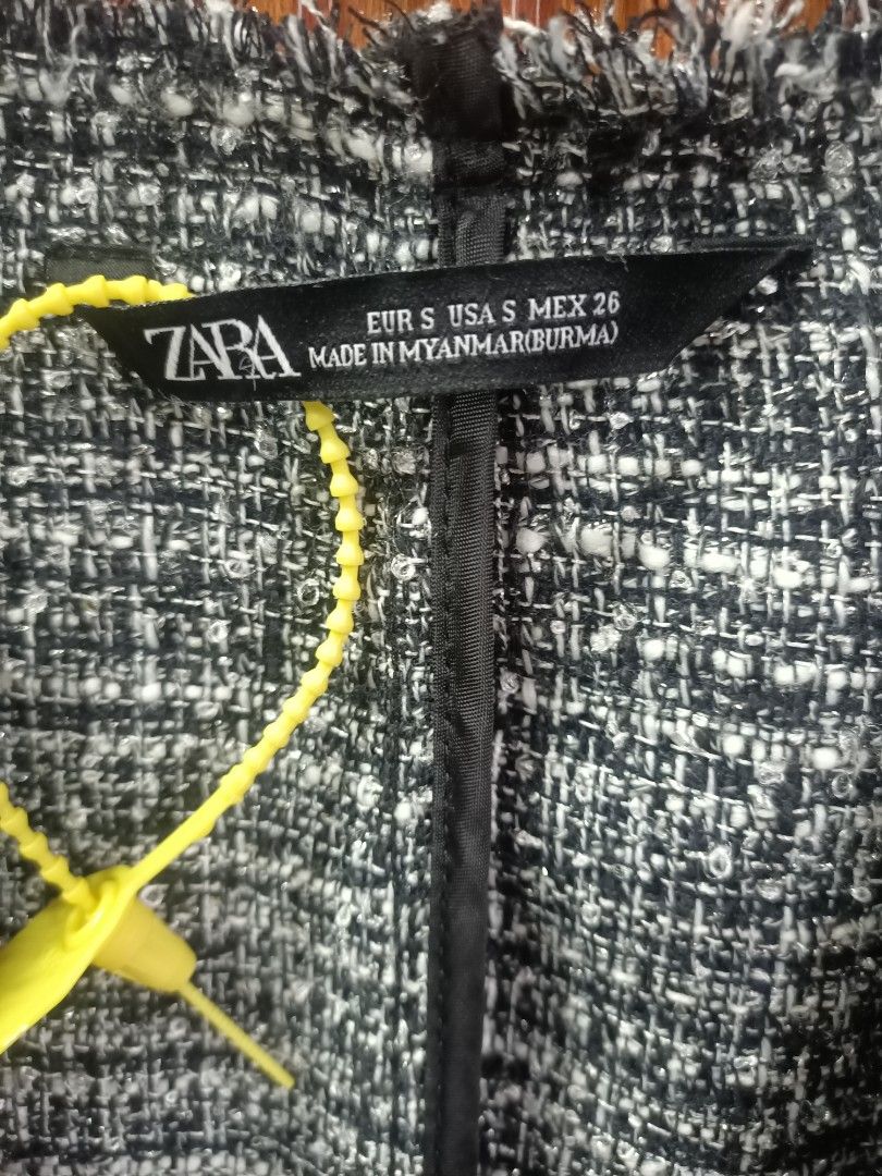 Zara Black and White Tweed Jacket Size S (Category: Coats, Jackets and Outerwear) located in Bayombong. Submitted by rheaaa00530 (Listing ID 1470083773, Image 2). Description: - Brand: Zara - Style: Open front tweed jacket with frayed trim and peplum waist - Details: Textured fabric with subtle metallic shimmer, long sleeves - Size: S - Versatility: Perfect addition to both casual and smart outfits.