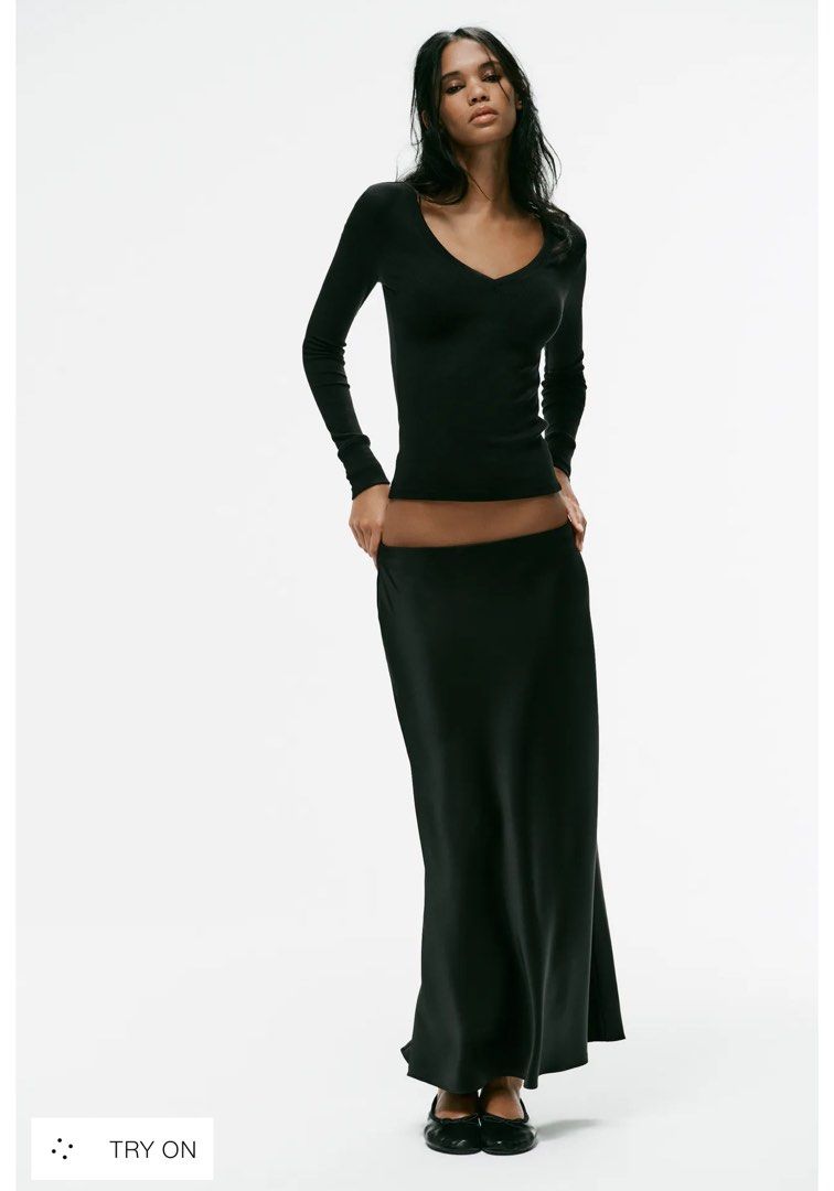 Zara Black Satin Long Skirt (Category: Skirts) located in Makati City. Submitted by chantalsy87 (Listing ID 1470056122, Image 2). Description: - Color: Sleek black - Material: Smooth satin with a glossy finish and lovely drape - Length: Midi to maxi - Waist: Low-rise style - Style: Versatile minimalist piece, easy to dress up or down for day or night - Condition: Brand New, hindi kasya sakin.