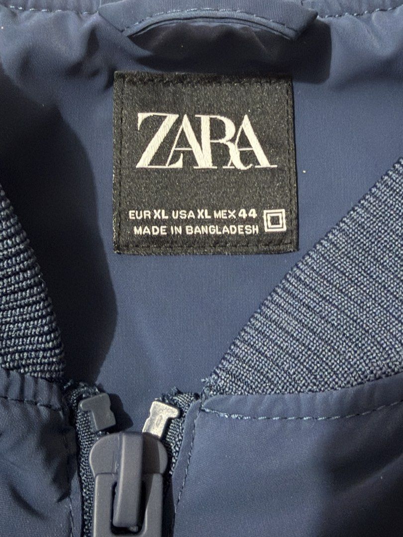 Zara Blue Bomber Jacket XL (Category: Coats, Jackets and Outerwear) located in Makati City. Submitted by joyjoytee (Listing ID 1470056291, Image 3). Description: - Brand: Zara - Style: Bomber jacket - Color: Blue - Size: XL (fits true to size) - Condition: Brand new with original tags, never worn - Features: Zip-up front, ribbed collar, cuffs, and hem, two side pockets - Origin: Made in Bangladesh.