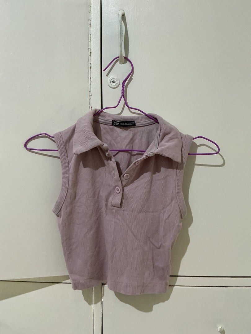 Zara Pink Ribbed Collared Sleeveless Crop Top (Category: Sleeveless) located in Rizal. Submitted by kyliemaine (Listing ID 1470033981, Image 1). Description: - Brand: Zara - Color: Soft pink - Size: M - Material: Comfortable stretch ribbed fabric - Design: Sleeveless with button placket and cropped length - Condition: Excellent / Pre-loved - Perfect for pairing with high-waisted jeans or skirts.