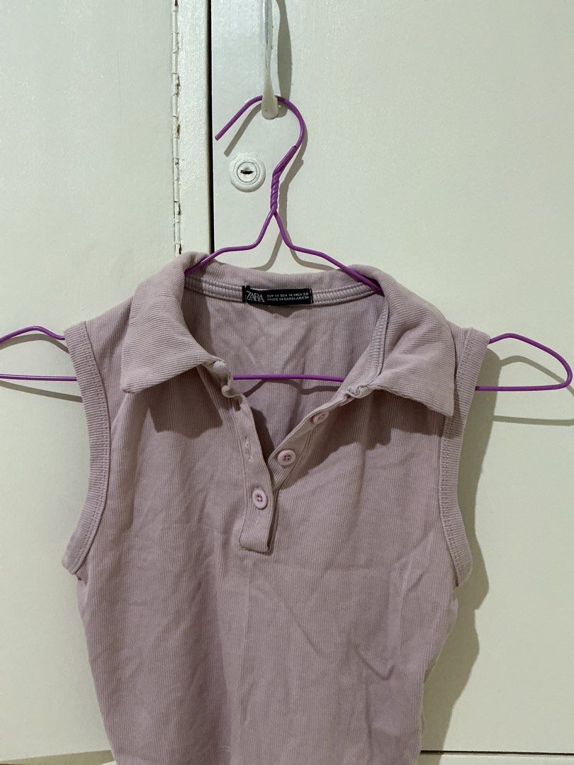 Zara Pink Ribbed Collared Sleeveless Crop Top (Category: Sleeveless) located in Rizal. Submitted by kyliemaine (Listing ID 1470033981, Image 2). Description: - Brand: Zara - Color: Soft pink - Size: M - Material: Comfortable stretch ribbed fabric - Design: Sleeveless with button placket and cropped length - Condition: Excellent / Pre-loved - Perfect for pairing with high-waisted jeans or skirts.