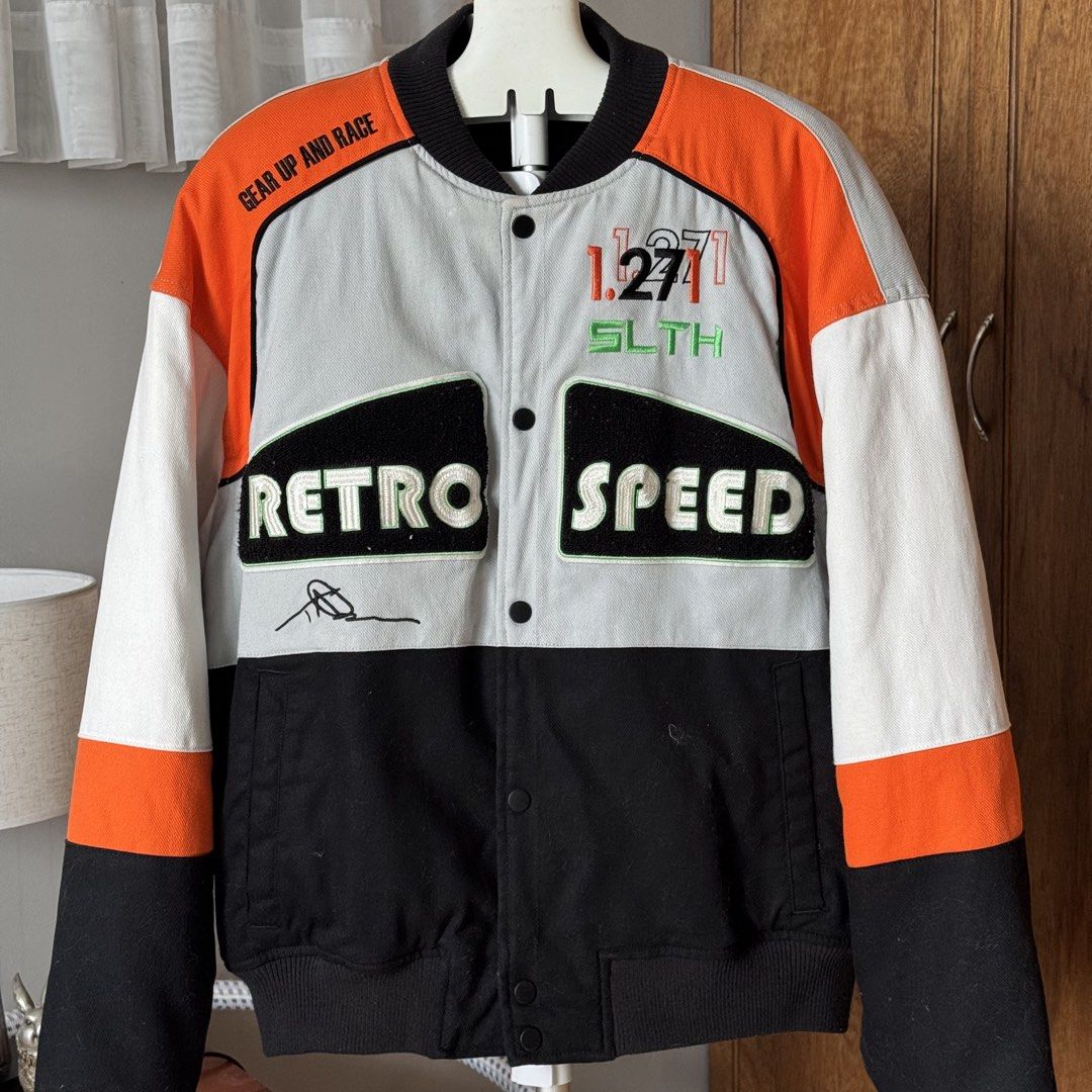 Zara Retro Speed Bomber Jacket Size M (Category: Coats, Jackets and Outerwear) located in Pura. Submitted by rarefindsph1205 (Listing ID 1470017329, Image 1). Description: - Brand: Zara - Style: Racing-style colourblock bomber jacket - Colourway: Black, orange, grey, and white - Details: 'RETRO SPEED' and 'BLANK CANVAS' patches on front and back - Closure: Snap button front - Trim: Ribbed collar, cuffs, and hem - Size: EUR M, USA M, MEX 40 - Orig