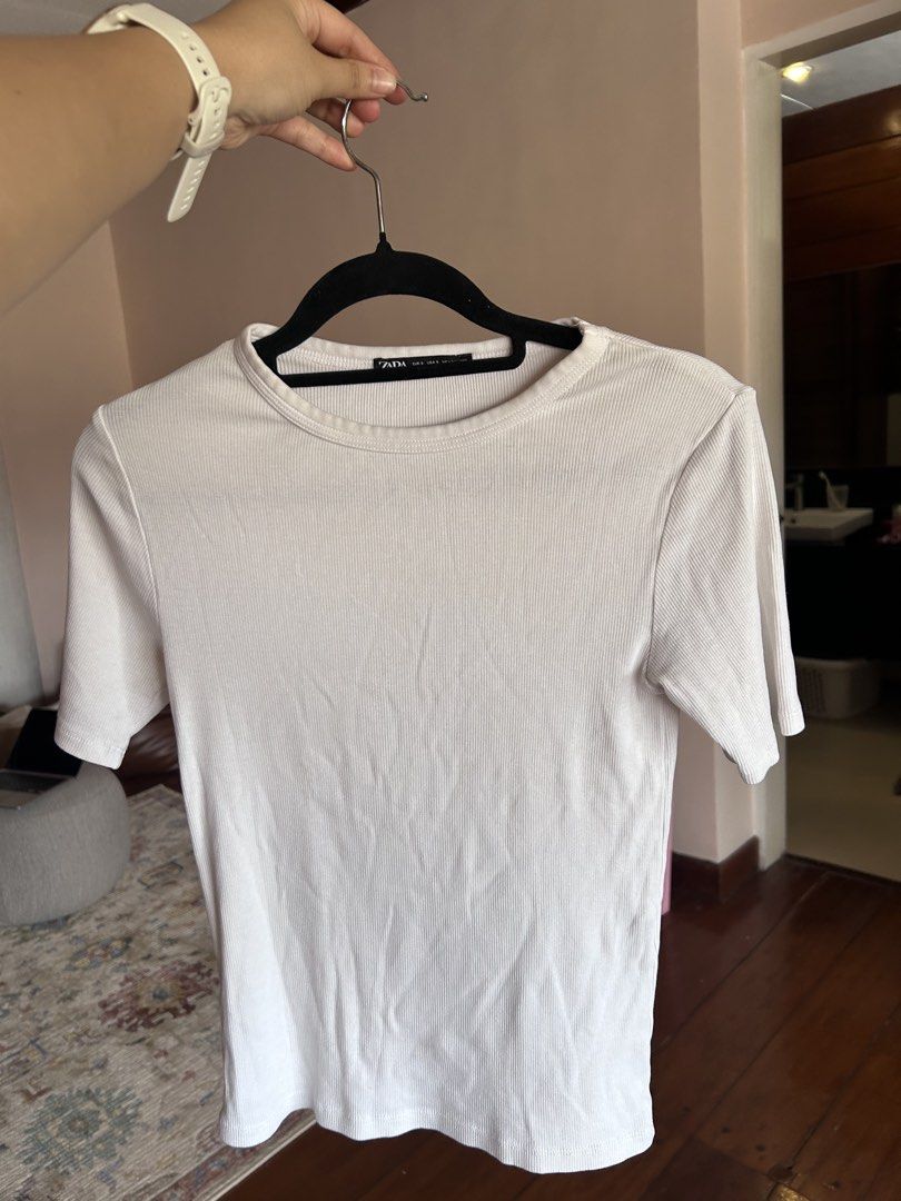Zara Ribbed White T-shirt Size S (Category: Shirts) located in Cebu City. Submitted by shopmikascloset (Listing ID 1469956576, Image 2). Description: - Brand: Zara - Style: Ribbed crewneck basic tee - Color: White - Size: S (fits true to size) - Material: Stretchy, comfy cotton - Origin: Made in Bangladesh - Condition: Worn a few times, still in solid condition with lots of life left - Pairing: Easy to style with jeans or skirts.