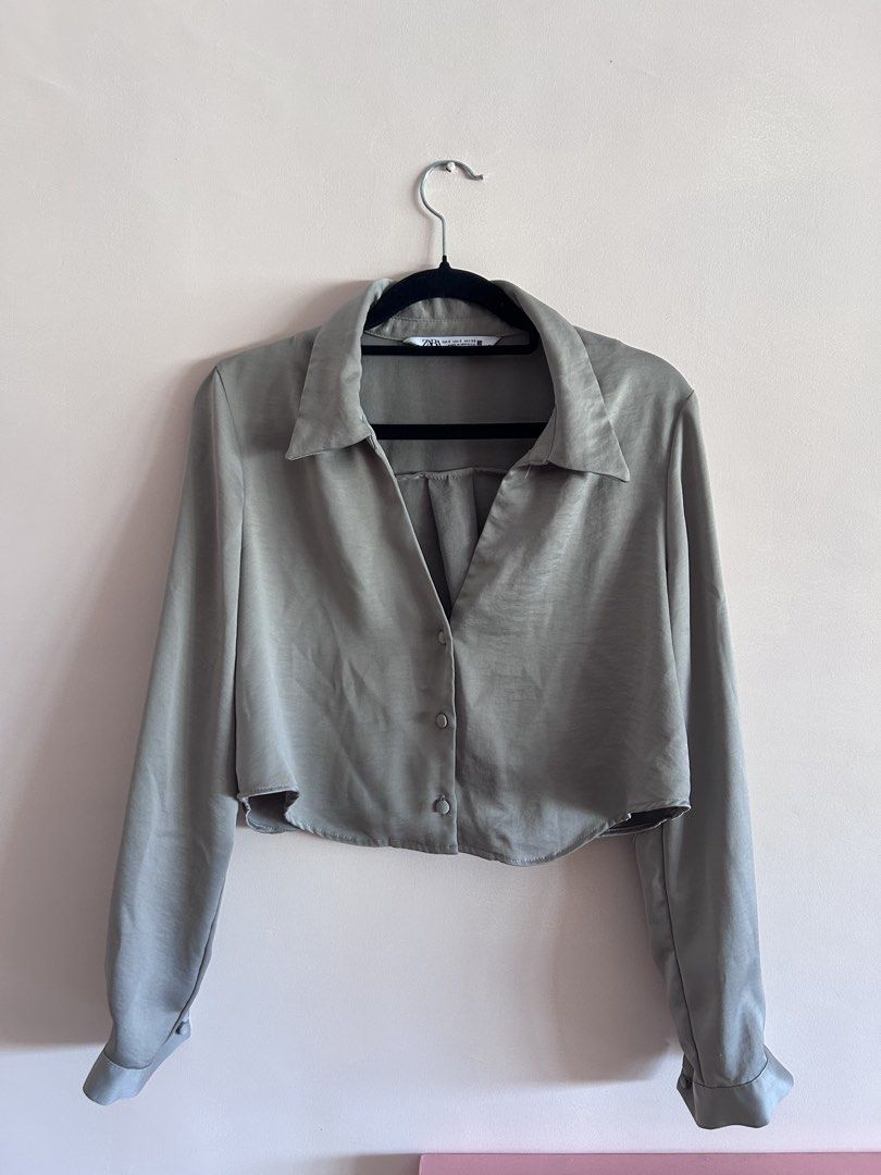 Zara Satin Long Sleeve Button Down Shirt (Category: Longsleeves) located in Cebu City. Submitted by shopmikascloset (Listing ID 1469956183, Image 1). Description: - Brand: Zara - Size: S (Made in Morocco) - Color: Greyish beige - Material/Finish: Satin with a nice sheen - Cut: Cropped with a curved hem - Features: Long sleeves with button cuffs and classic collar - Condition: Clean inside and out - Styling: Easy to dress up with trousers or keep 