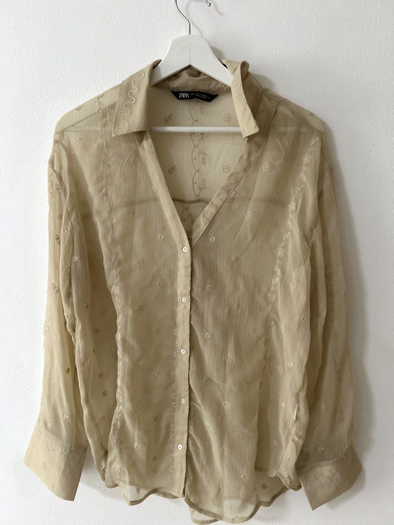 Zara Sheer Embroidered Beige Button-Down Shirt (Category: Blouses) located in Manila. Submitted by isabelle_1104 (Listing ID 1469967095, Image 2). Description: - Brand: Zara - Size: S - Color: Beige sheer - Details: Scattered floral embroidery, wavy pattern on collar and cuffs, classic collar, long sleeves with button cuffs - Material: Light and breathable fabric - Origin: Made in India - Condition: Excellent.
