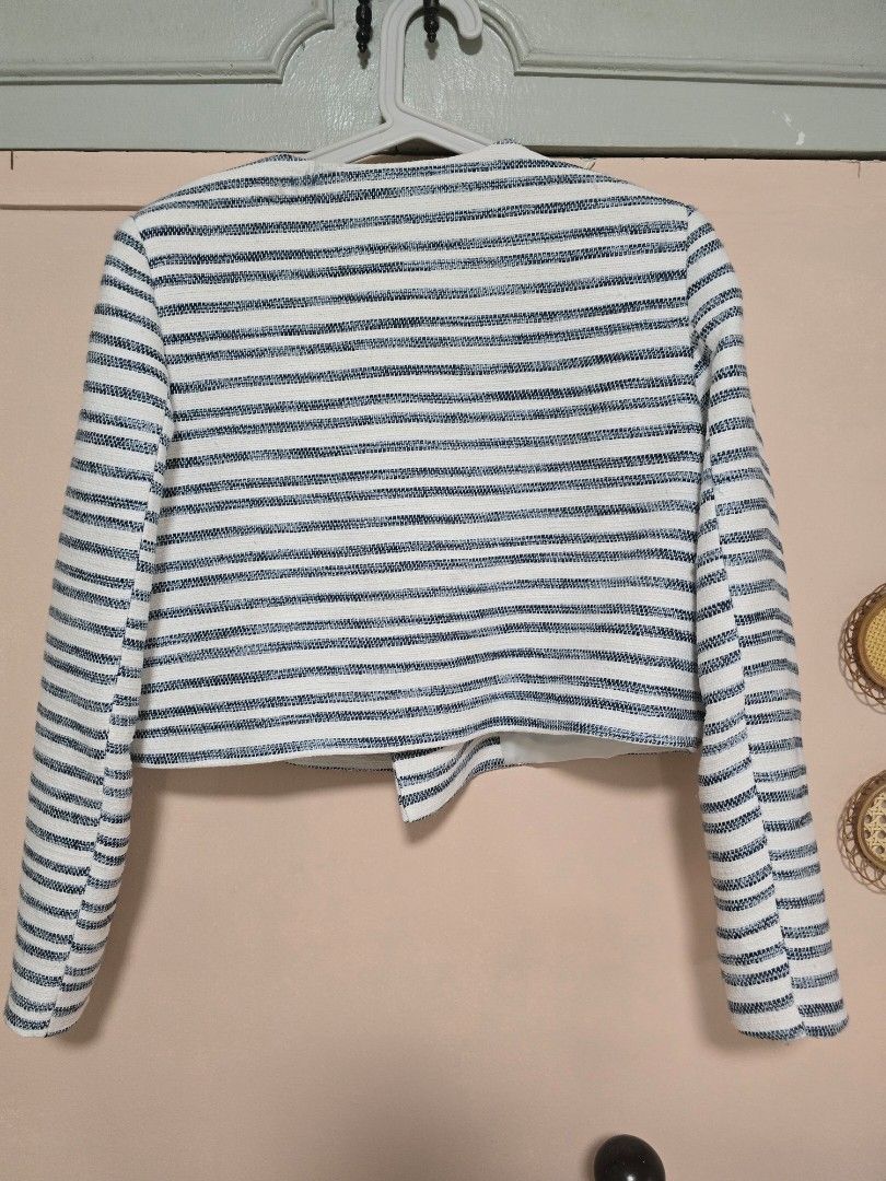 Zara Striped Crop Blazer Size M (Category: Coats, Jackets and Outerwear) located in Paranaque City. Submitted by jasminepc (Listing ID 1469967511, Image 2). Description: last price posted see flaw on last two pictures. can be managed by lint remover and cleaning the button. - Brand: Zara - Size: Medium - Color/Pattern: Blue and white striped - Material: Textured woven fabric with fully lined interior - Details: Gold-tone front buttons, faux pocke