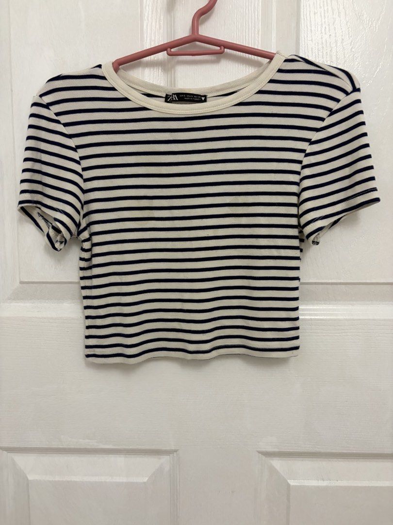 Zara Striped Crop Top Size S (Category: Blouses) located in Cabuyao City. Submitted by _camilleeee_ (Listing ID 1470052178, Image 1). Description: - Brand: Zara - Style: Black and white striped cropped tee with classic crew neckline and short sleeves - Material: Ribbed cotton texture - Size: S - Condition: Worn a few times, still in solid shape - Styling: Pairs easily with high-waisted jeans or skirts.