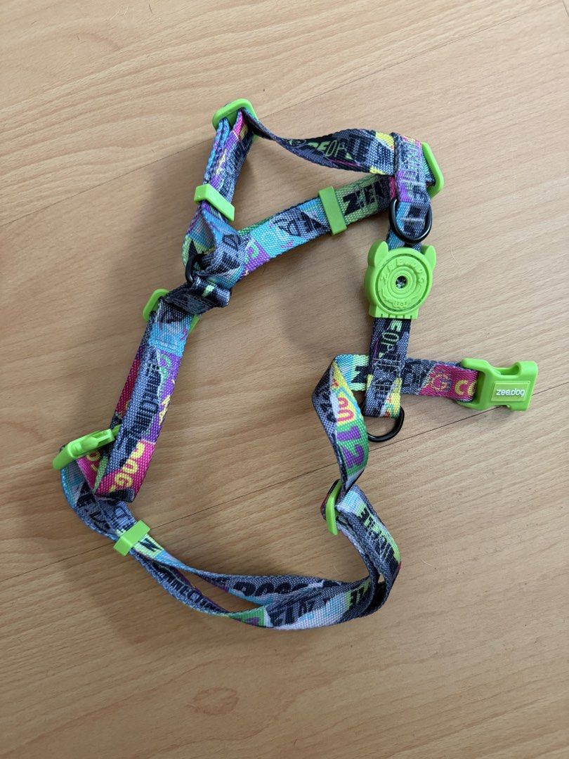 Zee Dog Harnesses (Category: Sleeveless) located in Quezon City. Submitted by milkiacream (Listing ID 1469985513, Image 1). Description: - Authentic Zee.Dog harnesses (Set of 2 or sold separately) (200 PHP) Harness 1: Medium Vibrant graffiti print with lime green hardware and buckles (500 PHP) Harness 2: Soft grey mesh with pink inner lining, secure Velcro closure, and purple trim Condition: Excellent, clean straps with zero fraying or chewed spo