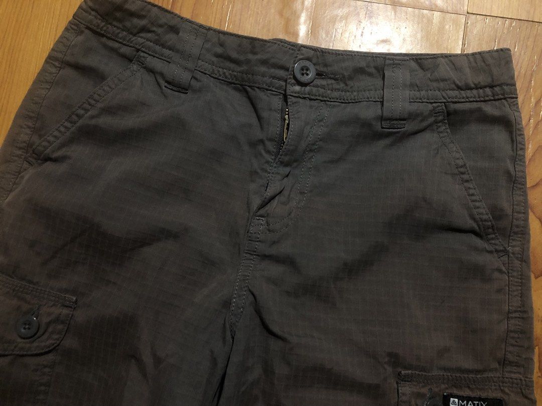 12y Matix Dark Grey Ripstop Cargo Shorts (Category: Babies & Kids Fashion) located in Quezon City. Submitted by lexipotpot (Listing ID 1470275003, Image 3). Description: - Brand/Model: Matix cargo shorts - Color: Dark grey with subtle grid texture - Material: Durable cotton blend - Pockets: Multiple utility pockets including buttoned cargo side pockets and rear flap pockets - Closure: Zipper fly with button closure - With discoloration as seen in