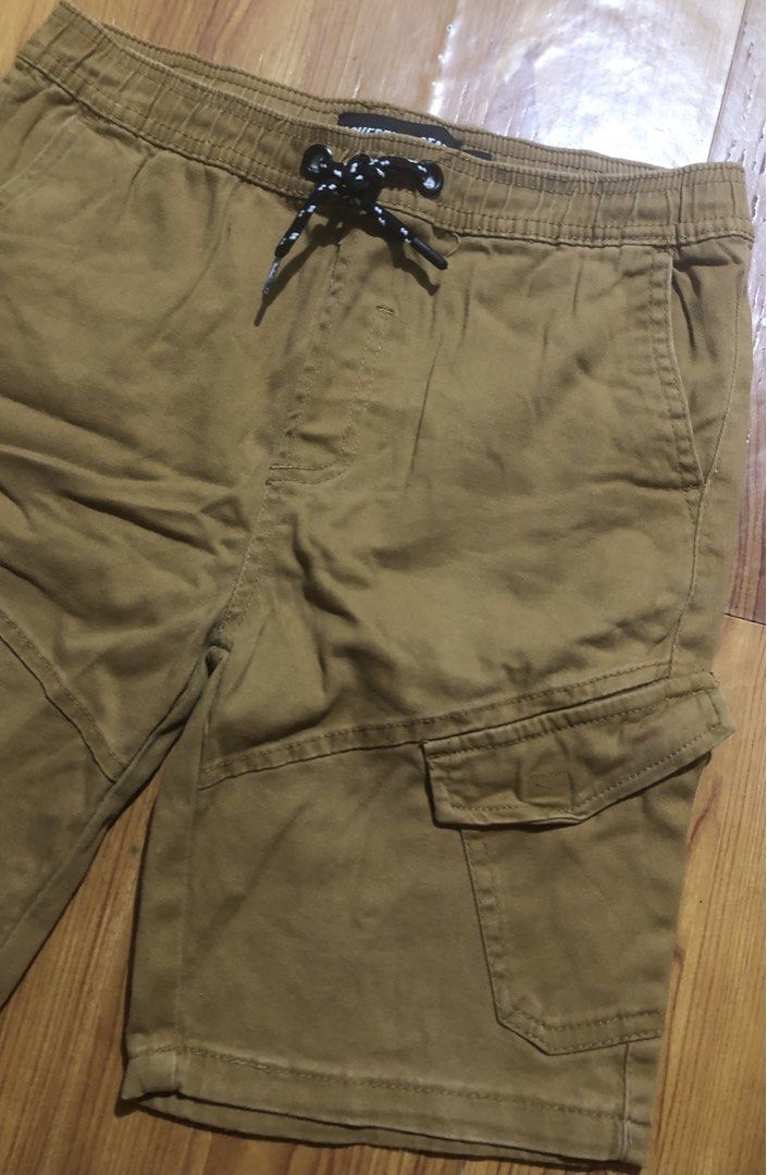 12y Sovereign State Brown Cargo Shorts (Category: Babies & Kids Fashion) located in Quezon City. Submitted by lexipotpot (Listing ID 1470173083, Image 2). Description: - Brand: Sovereign State - Color: Versatile brown - Waist: Elastic with adjustable black & white speckled drawstring - Pockets: Practical side cargo pockets with button flaps, plus standard front and back pockets - Material: Comfortable and breathable cotton-blend fabric - Can fit 