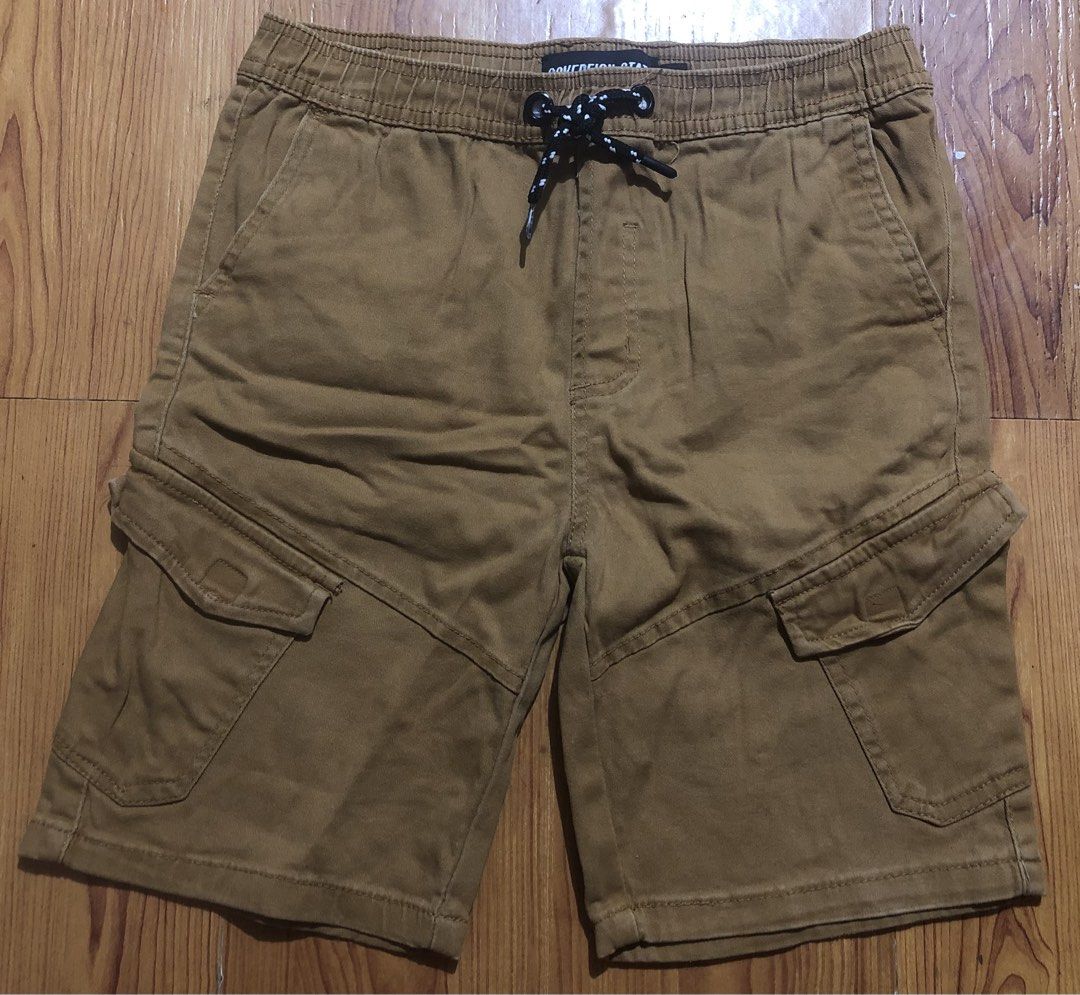 12y Sovereign State Brown Cargo Shorts (Category: Babies & Kids Fashion) located in Quezon City. Submitted by lexipotpot (Listing ID 1470173083, Image 1). Description: - Brand: Sovereign State - Color: Versatile brown - Waist: Elastic with adjustable black & white speckled drawstring - Pockets: Practical side cargo pockets with button flaps, plus standard front and back pockets - Material: Comfortable and breathable cotton-blend fabric - Can fit 
