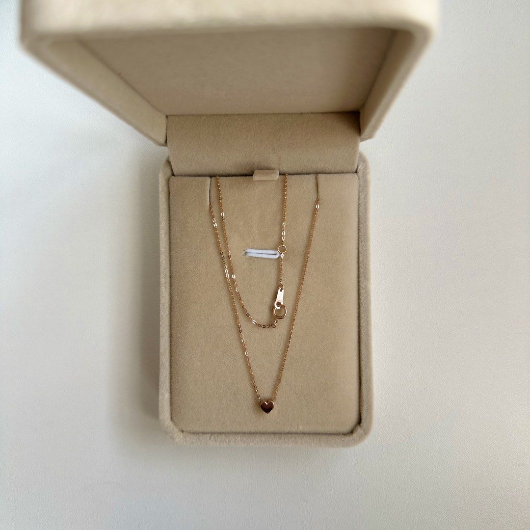 14K Rose Gold 16” & 16.5” Heart Necklace (Category: Necklaces) located in Mandaluyong City. Submitted by lestieco (Listing ID 1470211127, Image 1). Description: • 14k rose gold (pawnable) • Korean item • 16” and 16.5” • Heart necklace with flat cable chain • Heart pendant is movable but not removable • 4mm heart pendant • 16.5-inch adjustable chain with jump ring at 16” allows you to hook the clasp into two distinct lengths (16” or the end ring a