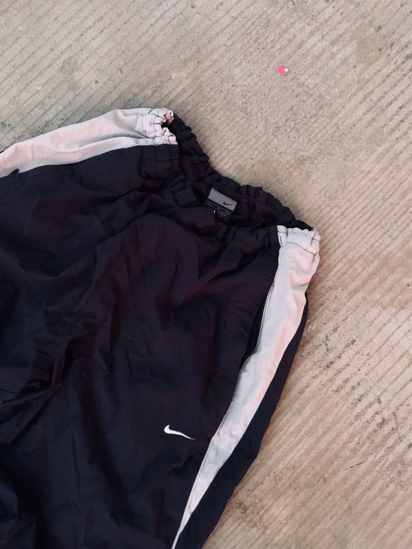 2000’s nike trackpants (Category: Jeans) located in Lipa City. Submitted by inglowetrust (Listing ID 1470264793, Image 3). Description: Garterized waist Adjustable zipper hem 21x41 Excellent condition Issue: 1 small pinhole .