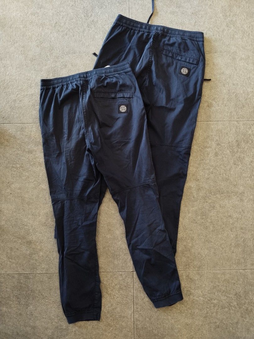 2 pcs Stone Island Type RE-T Pants (Category: Joggers) located in Pasig City. Submitted by loveforlux_2025 (Listing ID 1470236018, Image 1). Description: - Authentic Stone Island dark blue jogger pants -28 and 29 fits 30 - Comfortable elastic waistband with adjustable drawstring - Stylish ribbed ankle cuffs and reinforced knee panels - Secure zippered side pockets for convenience - Signature compass patch logo on the single back pocket - Clean co