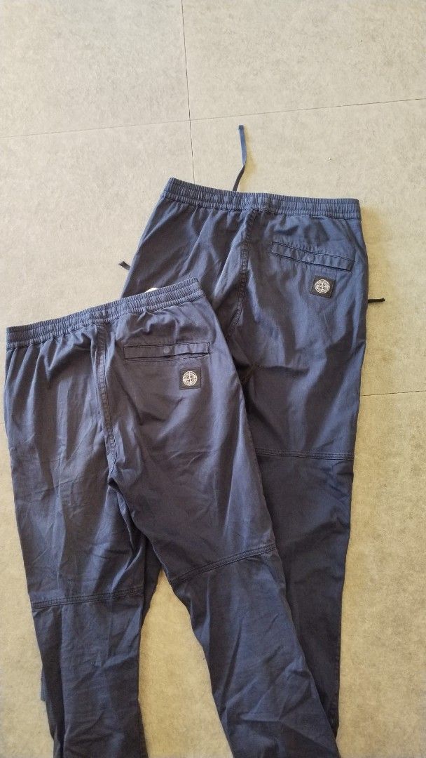 2 pcs Stone Island Type RE-T Pants (Category: Joggers) located in Pasig City. Submitted by loveforlux_2025 (Listing ID 1470236018, Image 2). Description: - Authentic Stone Island dark blue jogger pants -28 and 29 fits 30 - Comfortable elastic waistband with adjustable drawstring - Stylish ribbed ankle cuffs and reinforced knee panels - Secure zippered side pockets for convenience - Signature compass patch logo on the single back pocket - Clean co
