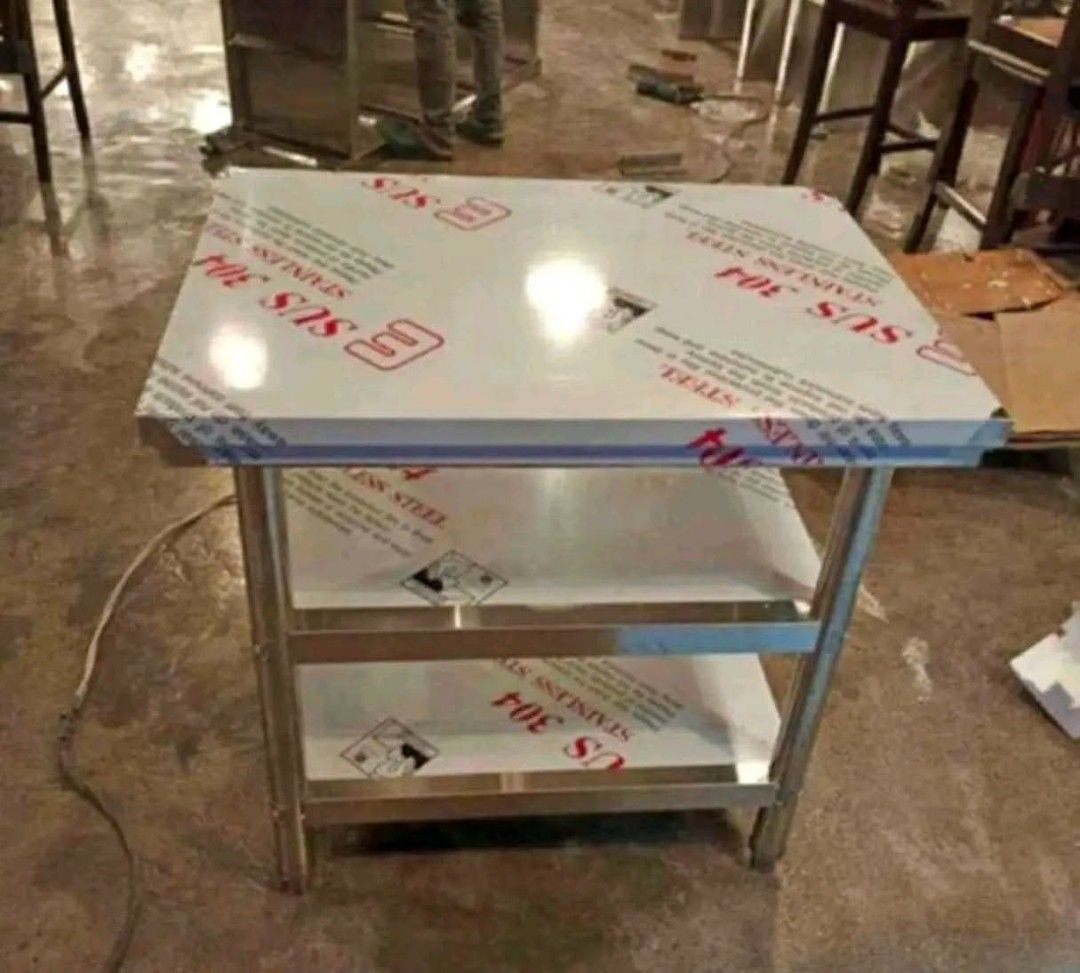 3-Tier Stainless Steel Utility Table Prep Work Bench 80x60x80cm (Category: Tables & Sets) located in Manila. Submitted by mightytiger_4bb6fd (Listing ID 1470218219, Image 2). Description: - Type: 3-tier heavy-duty stainless steel utility table - Condition: Brand new and unused, protective plastic film still on shelves and top - Build: Sturdy metal legs and frame for maximum durability - Versatile Use: Ideal for kitchen prep, workshop storage, or 