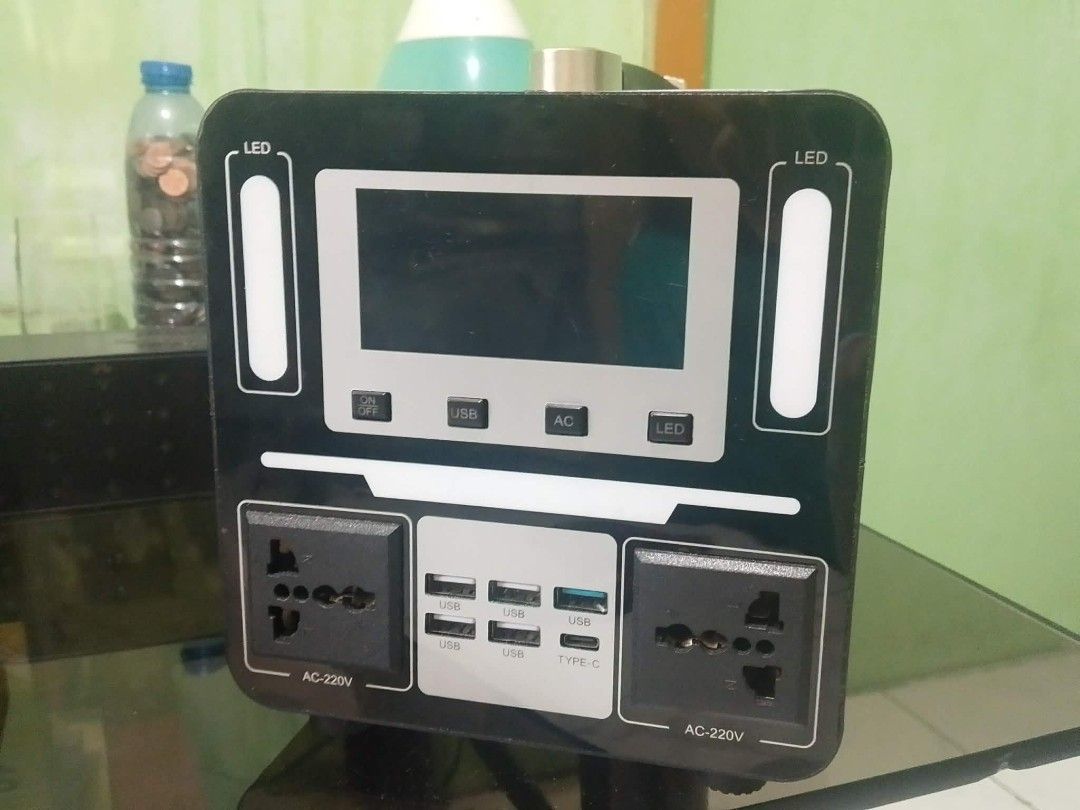 800W Portable Power Station with 20W Solar Panel Kit (Category: Batteries & Power Banks) located in Bacoor. Submitted by gentlemucles (Listing ID 1470166845, Image 2). Description: - 800W solar portable power station bundle complete with a 20W solar panel and charging cables - Clear digital display showing battery voltage and output status - Versatile connectivity with multiple AC outlets, USB ports, and a Type-C port - Built-in dual LED side lig