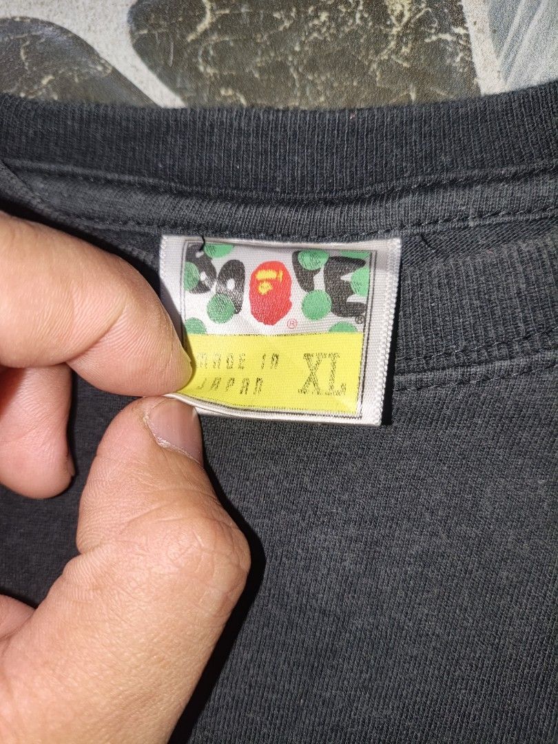 Aape By A Bathing Ape Black T-Shirt (Category: Tshirts & Polo Shirts ) located in Narvacan. Submitted by picky_looter (Listing ID 1470299140, Image 2). Description: - Brand: Aape by A Bathing Ape - Color: Classic Black - Size: XL - Material: 100% Cotton, Made in Japan - Design: Large white ape head graphic on front with text - Details: Small ape logo on back collar and sleeve tag - Fit: Regular crew neck, short sleeve.
