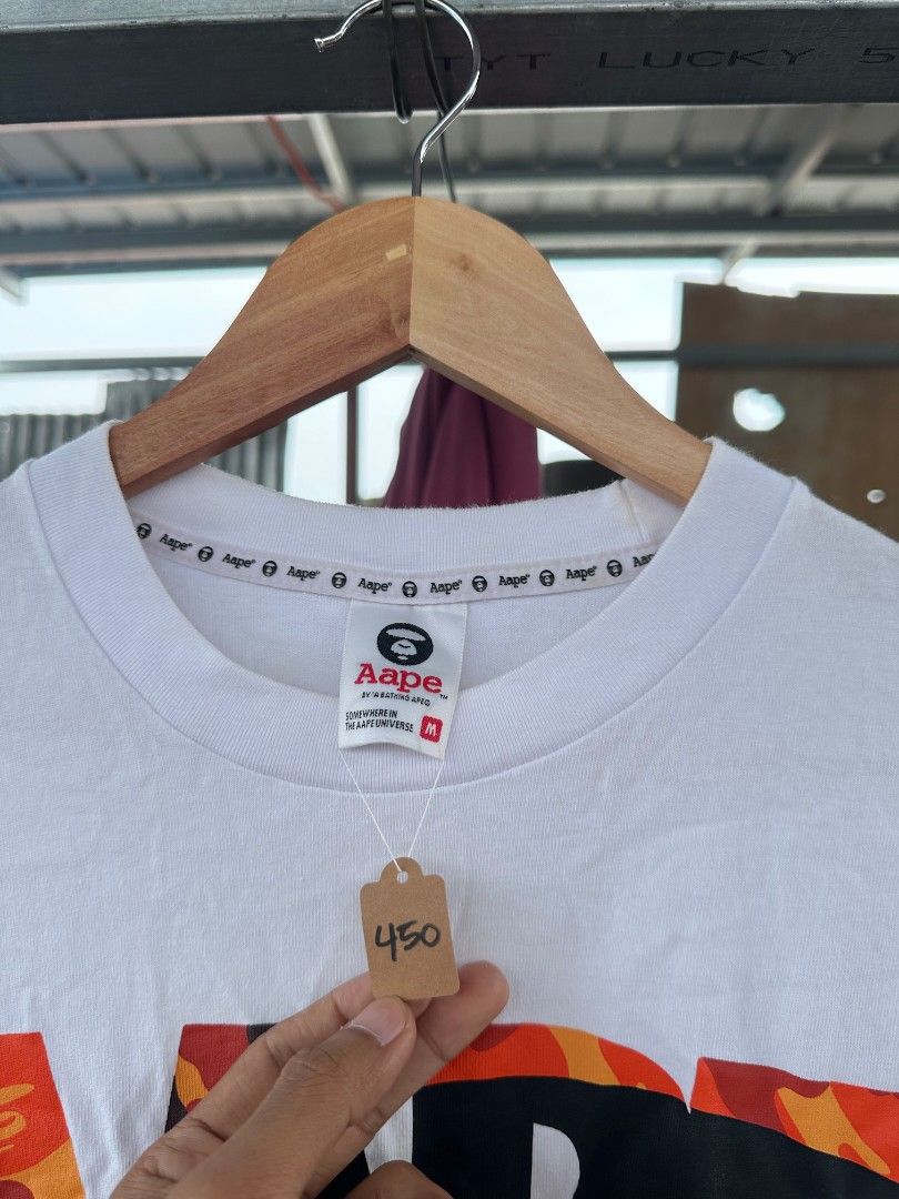 Aape by abathing ape camauflage graphic Tee (Category: Tshirts & Polo Shirts ) located in Davao. Submitted by boss_kel (Listing ID 1470146874, Image 3). Description: No crack prints, Solido pa cut washtag pang tas need malabhan may mga minimal stain na sure naman na matatanggal, Maliliit lang rin.